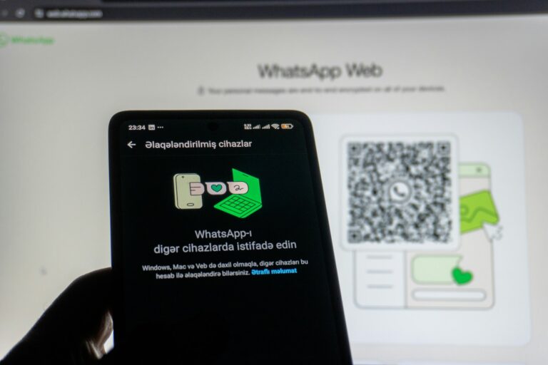 Phone scanning whatsapp web qr code on screen